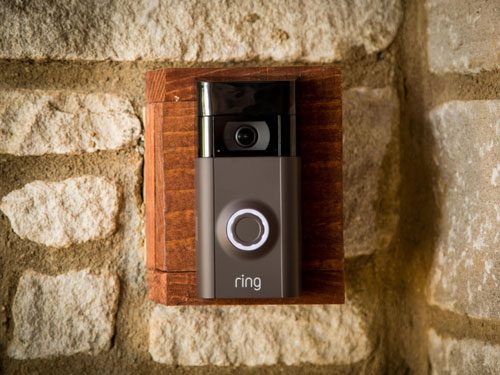 Video doorbell on brick wall